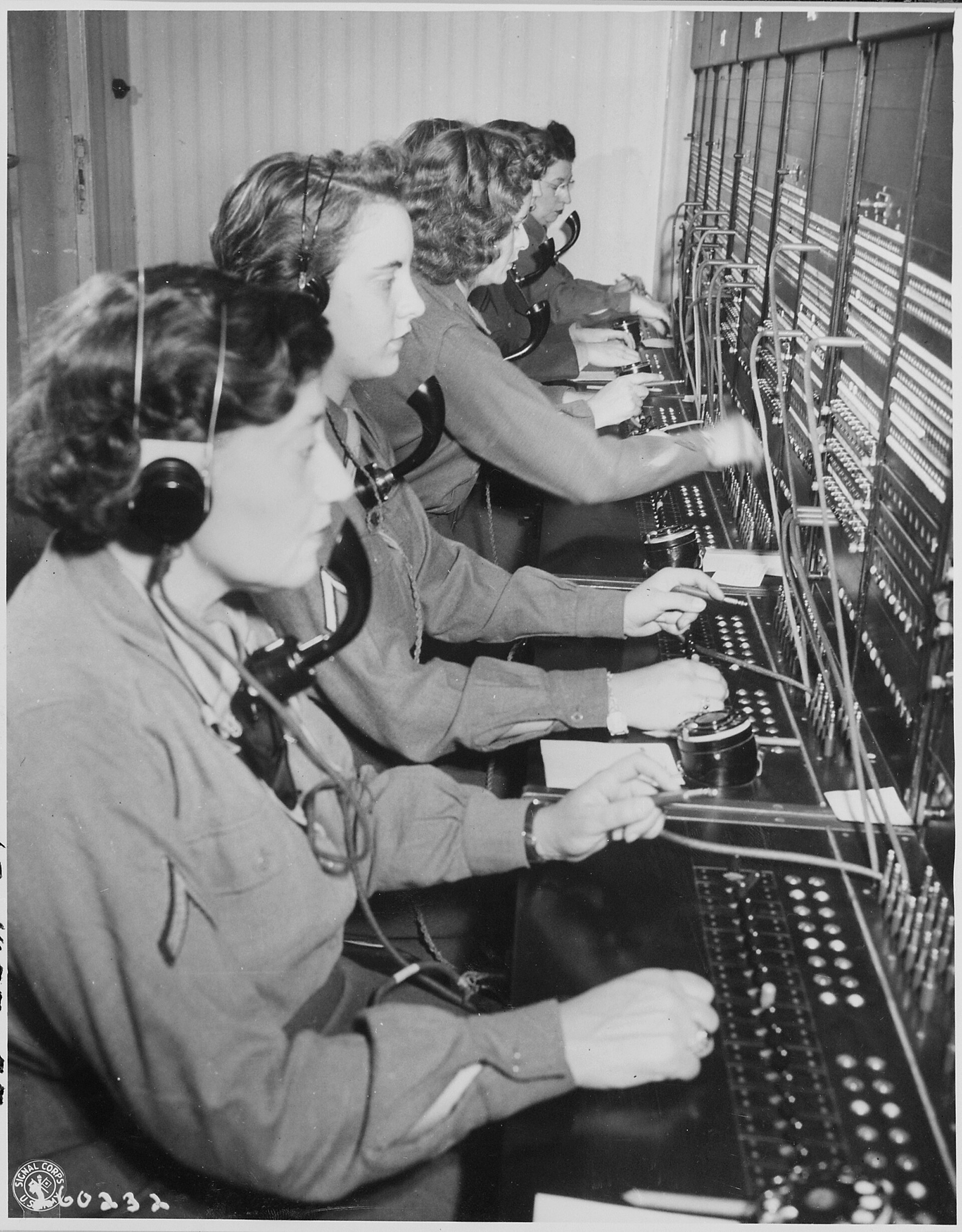 Telephone operators working a switchboard in 1945